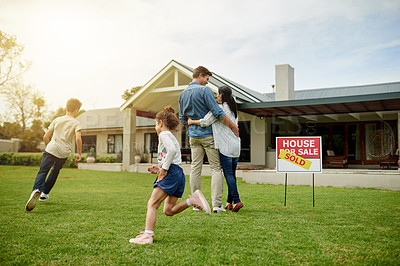 Buy stock photo Yard, real estate and new home for family, hug and milestone for homeowner with property and purchase. Outdoor, relocation and people with investment of house, playing and parents with children