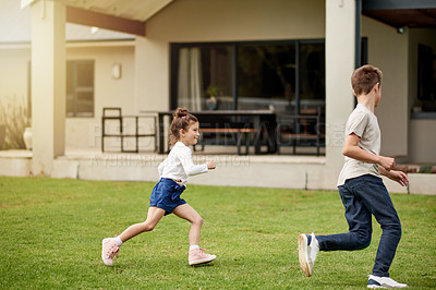 Buy stock photo Children, running and fun game in backyard with energy, playful chase and race for bonding together. Kids, boy and girl with movement for exploring activity, creative adventure and childhood at house