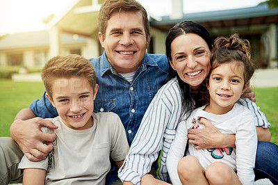Buy stock photo Family, portrait and happy hug on lawn in home backyard, love and together for security. Parents, children connect and outdoor to relax in trust embrace, support and relationship bonding in nature