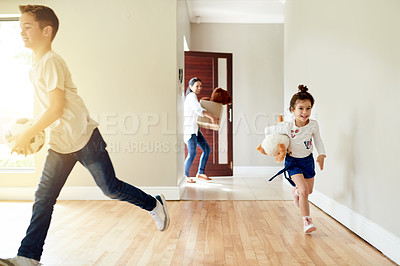 Buy stock photo Excited, children and running with energy to new home for playful fun, joyful movement and explore property. Happy, kids and parents with boxes for relocation, discovery game and apartment investment