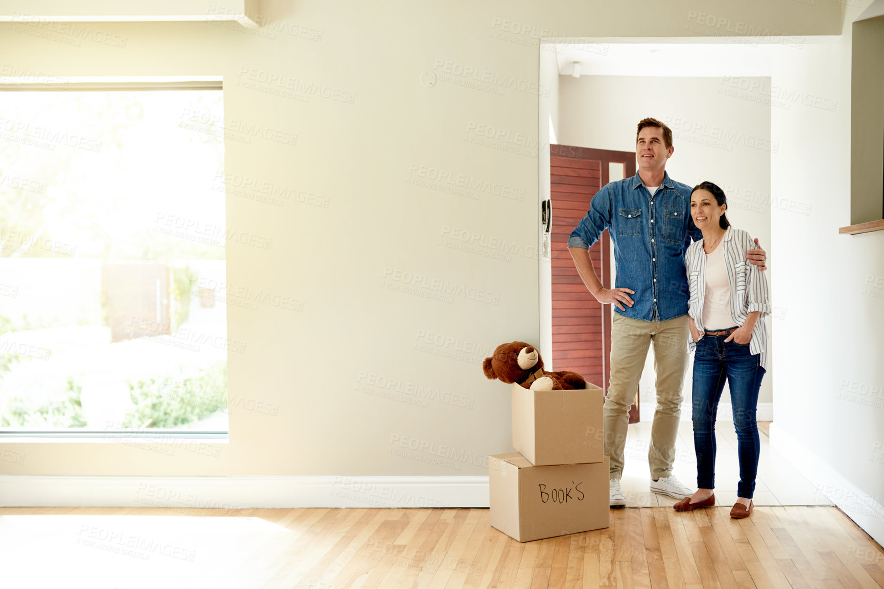 Buy stock photo Boxes, moving and couple hug in new home for property ownership, relocation and investment. Cardboard, love and people with packages for buy real estate together in marriage for commitment at house.