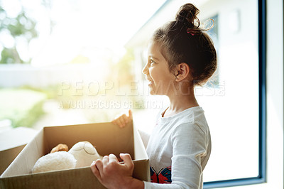 Buy stock photo New house, boxes and girl with smile, profile and toys with rent for property, happiness and cheerful. Apartment, cardboard and real estate with lens flare, goals and mortgage with joy and moving