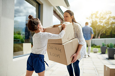 Buy stock photo Mother, girl and helping with boxes at new house for property investment, relocation support and security. Real estate, woman and child with teamwork for moving in, mortgage milestone and fresh start
