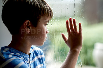 Buy stock photo Sad, boy child and thinking by window with depression, abandoned and trauma from loneliness. Person, orphan and mental health in home with nostalgia, anxiety and waiting on adoption at foster care