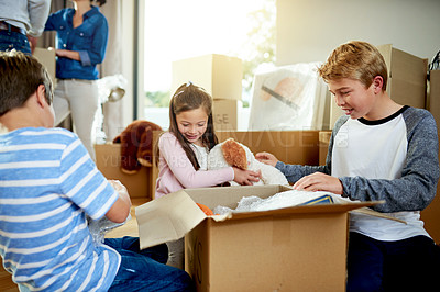 Buy stock photo Moving, boxes and kids packing in new home with sorting items for donation, charity or community. Cardboard, fun and children helping to sort household supplies for relocation in family house.