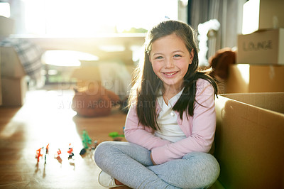 Buy stock photo Home, child and packing toys in boxes, moving and relocation portrait on living room floor. Female person, real estate investment and confidence in new house, dream property and leaving apartment