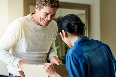 Buy stock photo Relocation, smile and couple with box, new home and apartment for moving in together, rent and happy. Real estate, relationship and people with property for marriage, packing and bonding for house