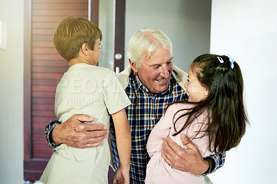 Buy stock photo Kids, smile and hugging grandfather for visit in home with arrival welcome, greeting and reunion. Excited people, family connection and embrace by front door with bonding together and relationship