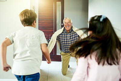 Buy stock photo House, greeting and grandfather with kids, smile and bonding together with happiness. Family, senior man and children in lobby, excitement and joyful with love, reunion and running in lounge