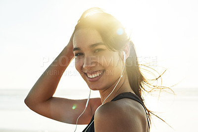 Buy stock photo Portrait, music and happy woman at beach on holiday, travel and listening to rock album at sunset. Face, outdoor and confident girl with earphones for audio, sound or streaming radio by sea in Mexico