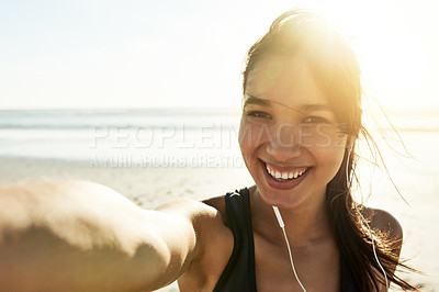 Buy stock photo Woman, selfie and happy for exercise at beach, portrait and excited for post on web with fitness at sunrise. Girl, person and smile with earphones, streaming and listen to music for workout in Italy