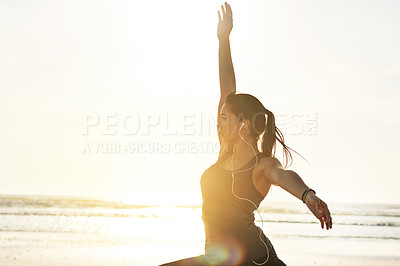 Buy stock photo Girl, music or beach yoga at sunset for balance, calm or peaceful mindset in zen mockup space. Lunge pose, earphones or wellness frequency tone for mental clarity, stretching and body movement by sea