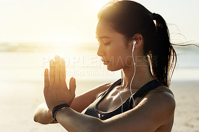 Buy stock photo Beach, meditation and woman with earphones, zen and listening to chanting for peace, music or outdoor. Namaste, mindfulness and streaming mantras on radio, calm or self awareness for person in nature