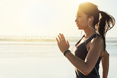 Buy stock photo Fitness, running and woman at ocean with earphones, sunrise and commitment to healthy outdoor workout. Music, training and girl jogging at beach for morning exercise, body wellness and mockup space