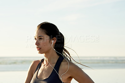 Buy stock photo Exercise, beach and mockup with woman thinking for running, workout and summer goal with music. Athlete, earphones and ready to start jog for fitness, endurance or health for wellness sport training
