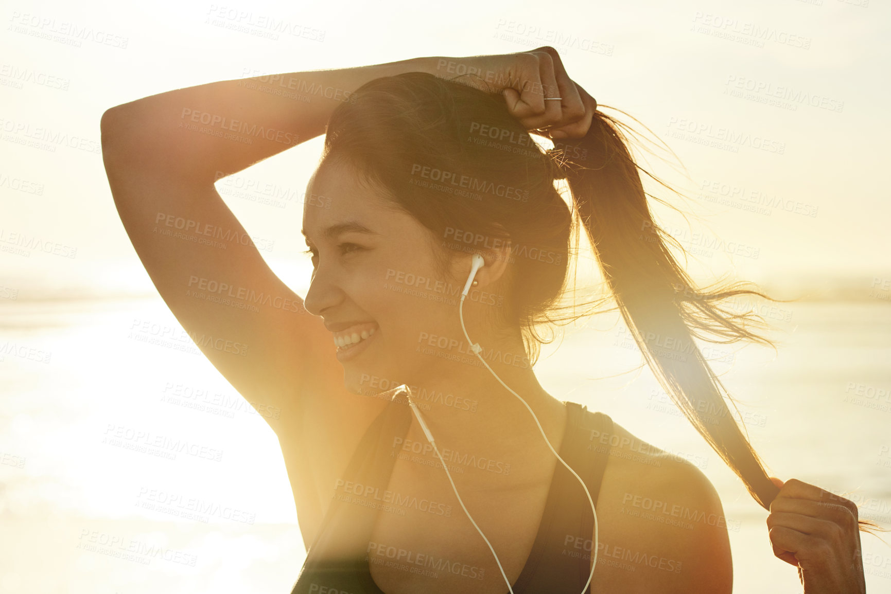 Buy stock photo Fitness, beach and thinking with woman prepare for running, workout and sunset with music. Athlete, sunshine or ready to start jog for exercise, endurance or summer health for wellness sport training