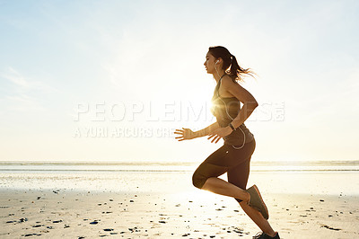 Buy stock photo Workout, running and girl on beach with earphones, sunrise and commitment to healthy outdoor exercise. Music, training and woman at ocean for morning fitness, body wellness and mockup space in nature