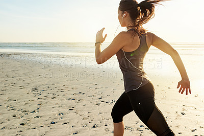 Buy stock photo Speed, running and woman on beach with music, sunrise and commitment to healthy outdoor workout. Earphones, training and girl runner at ocean for morning exercise, body wellness and jogging in nature