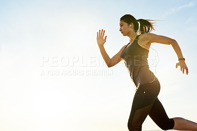 Buy stock photo Woman, running and exercise at sunrise with earphones, training or listen to music with mock up space in morning. Girl, person and sound with streaming, subscription and fitness with speed in Spain