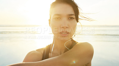 Buy stock photo Exercise, beach and arm stretching with woman prepare for running, workout and thinking with music. Athlete, warm up or ready to start jog for fitness, endurance or health for wellness sport training
