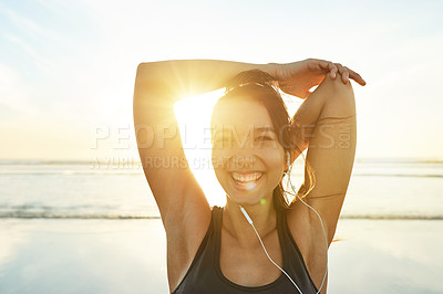 Buy stock photo Sea, earphones or happy woman stretching for fitness, healthy body or wellness at sunset. Warm up arms, music or athlete outdoor to prepare for exercise, training or ready for sports workout at beach