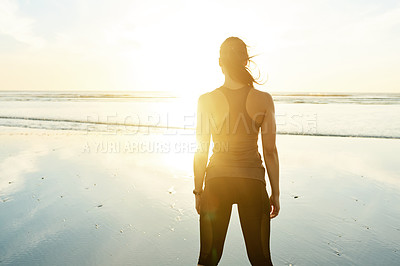 Buy stock photo Fitness, sunrise and woman with break by beach for workout, exercise and resting with lens flare. Back, space and athlete for sightseeing, nature scenery or body wellness with sunset view by seashore