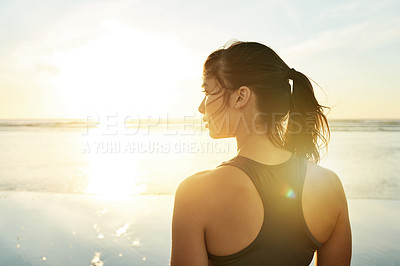 Buy stock photo Fitness, sunset and woman relax by beach for workout break, exercise and resting with lens flare. Back, female athlete and sightseeing with sunrise view, nature scenery and body wellness by seaside