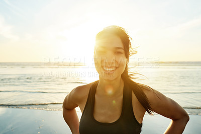 Buy stock photo Woman, happy or portrait on beach for fitness, wellness or exercise break at lens flare. Runner, sunset or smile at Colombia ocean for resting, commitment or pride for physical journey with sky space