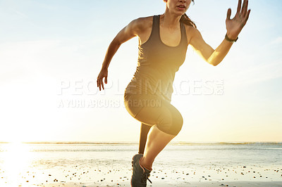 Buy stock photo Fitness, body and woman running by beach for resistance training, marathon exercise or cardio challenge. Sunset flare, athlete and sprinting by ocean for competition performance, workout or endurance