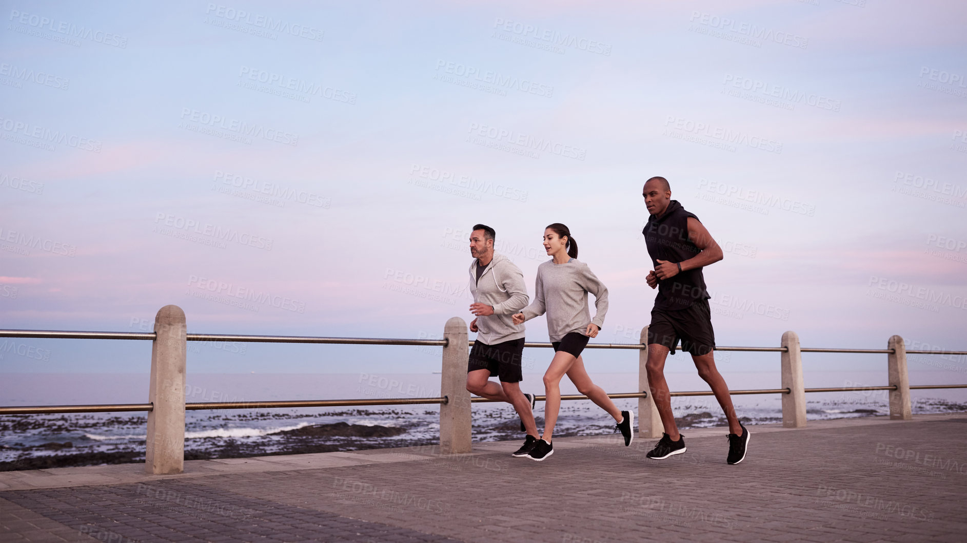 Buy stock photo Fitness, men and woman on promenade for exercise, wellness and endurance training. Athlete, friends and running challenge with workout, physical health and resilience for summer and cardio together