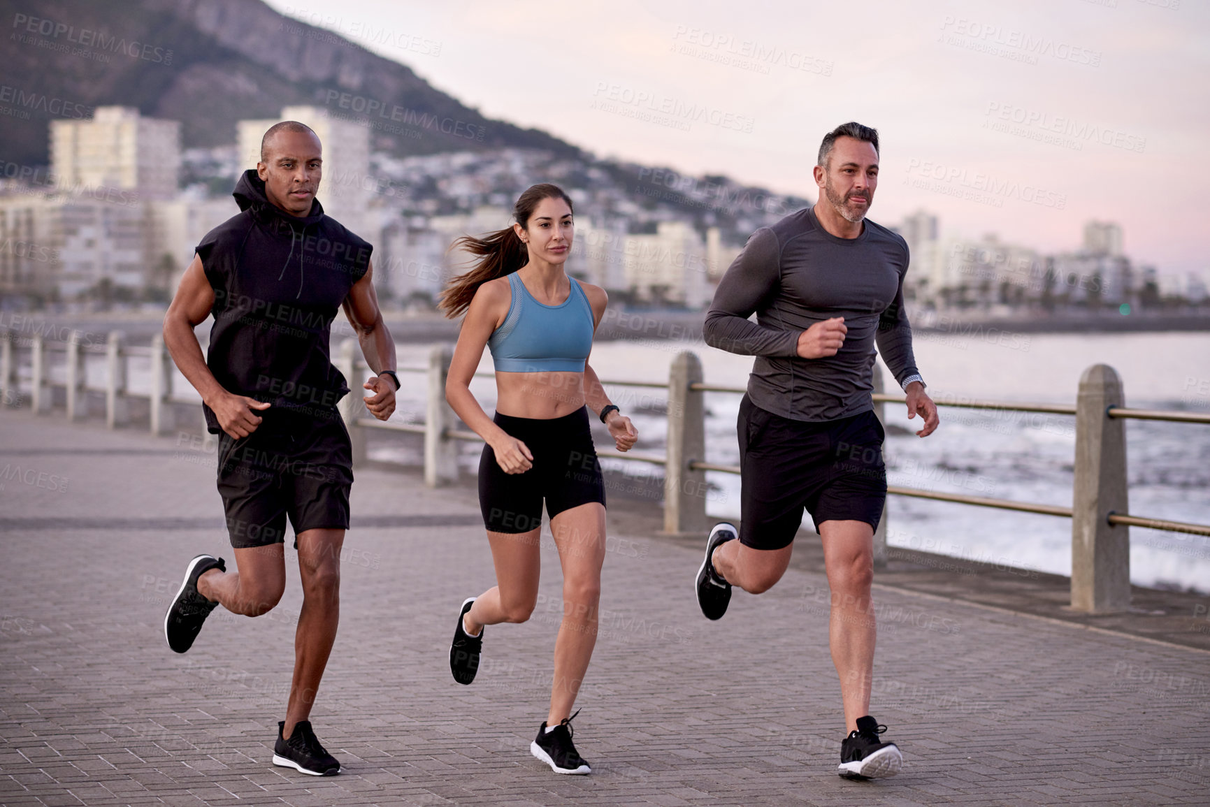 Buy stock photo Fitness, men and woman on promenade for training, wellness and endurance exercise. Athlete, group of friends and running challenge with workout, physical health and resilience for cardio together