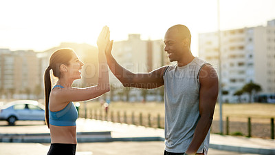Buy stock photo High five, interracial couple and city sunset for exercise, wellness or endurance workout. Athlete, man and woman with training challenge for fitness, physical health or resilience or cardio together