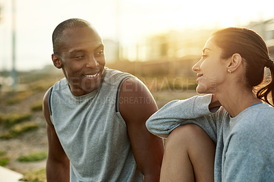 Buy stock photo Outdoor, couple and happy with break for fitness, wellness and bonding with connection for exercise. City, woman and man with support for training rest, conversation and healthy relationship by flare