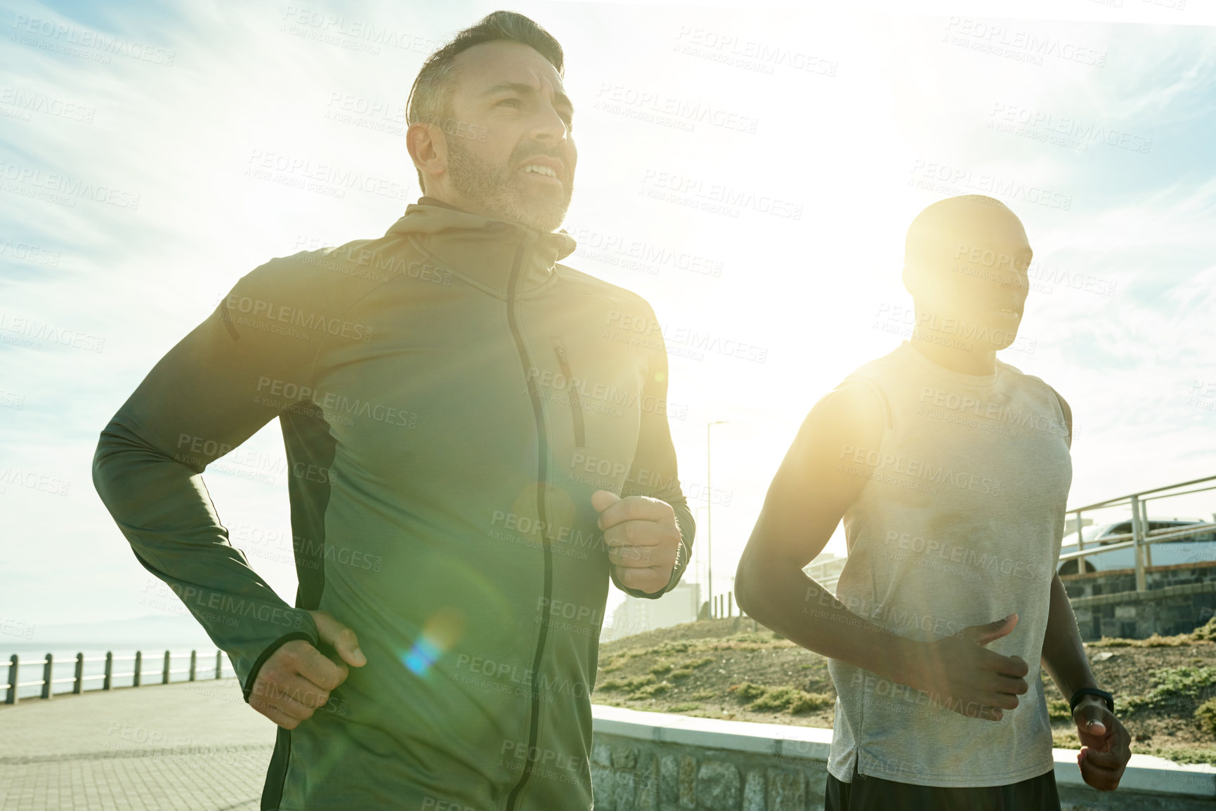 Buy stock photo Men, flare or running for city fitness, exercise or workout wellness on promenade park. Friends, team or personal trainer with athlete for sports marathon, race or competition training accountability