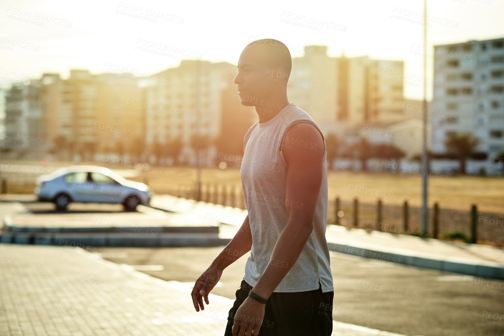 Buy stock photo Black man, fitness or walking exercise in city for running, workout or cardio training in parking lot. Challenge, athlete or runner on break in practice for health, wellness and sports performance