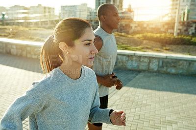 Buy stock photo Fitness, interracial couple and running in city for training, body wellness or health outdoor. Team, man and woman with cardio exercise for workout, sport or race with energy for endurance marathon