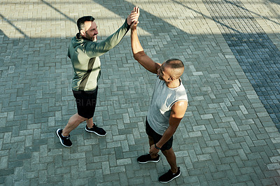 Buy stock photo High five, athlete and celebration for friends, workout and personal trainer with motivation for client. Outdoor, above and people with smile for accomplishment, thank you and success for fitness