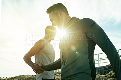 Buy stock photo Fitness, men and friends with handshake for support, team and success for workout by flare. Happy people, athlete and personal trainer with shaking hands for exercise, training and celebrate progress