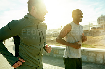 Buy stock photo Men, laughing or running for city fitness, exercise or workout wellness on promenade with summer flare. Friends, joke or funny personal trainer with athlete for marathon, race or competition training