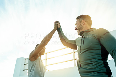 Buy stock photo Fitness, high five and motivation with sports men outdoor for cardio, marathon training or running. Goals, success and target with smile of friends in celebration of completed exercise from below