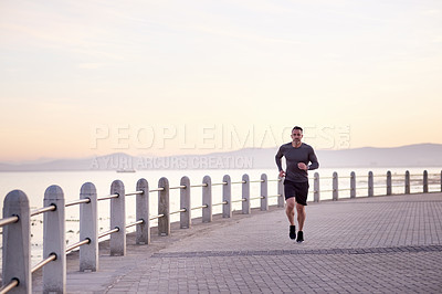 Buy stock photo Seaside, running and man with fitness, practice and wellness with workout, energy and routine. Person, athlete and runner with training, exercise and sports with body health, challenge and ocean