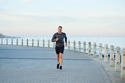 Buy stock photo Promenade, running and man with cardio, training and wellness with energy, morning or routine. Person, athlete or runner with performance, exercise or endurance with body health, challenge or workout