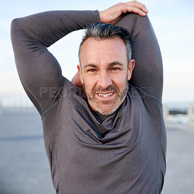 Buy stock photo Mature man, smile and stretching on promenade, arms and portrait for fitness, health and ocean in morning. Person, exercise and runner in summer by sea, wellness and happy for workout in Australia