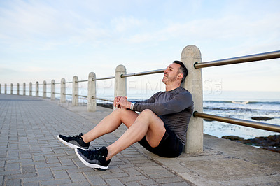 Buy stock photo Fitness, mature man and rest outdoor on floor with workout recovery, exhausted and tired of running challenge. Blue sky, runner and break at promenade with exercise burnout, endurance and breathing