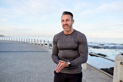 Buy stock photo Happy, runner and man in morning by ocean for exercise, marathon training and cardio workout. Sports, promenade and person for wellness, health and recovery for performance, endurance and fitness