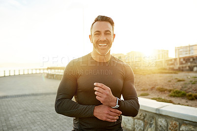 Buy stock photo Runner, fitness and portrait of man in city in morning for exercise, marathon training or workout. Sports, lens flare and person for wellness, rest and happy for performance, endurance and running