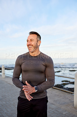 Buy stock photo Happy, running and man by ocean for exercise, marathon training and cardio workout outdoors. Sports, promenade and person for wellness, health and recovery for performance, endurance and fitness