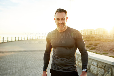 Buy stock photo Portrait, fitness and man in city in morning for exercise, marathon training or cardio workout in town. Sports, sunshine and person for wellness, rest and happy for performance, endurance and running