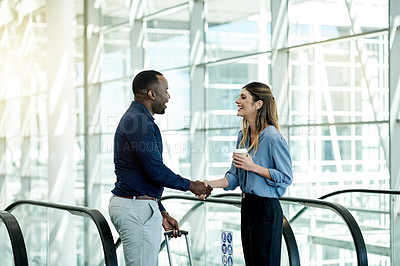 Buy stock photo Escalator, handshake and luggage with business people in airport lobby for friendly greeting or meeting. B2B, travel or welcome with employee man and woman shaking hands for international partnership