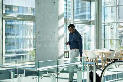 Buy stock photo Black man, phone and walking to escalator at airport, business travel and online for flight info. Male person, pharmaceutical representative and bag for product at seminar, communication and stairs